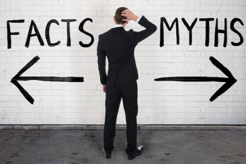 Man standing between two arrows, one pointing to Facts, one pointing to Myths