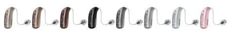 A row of hearing aids in various colours