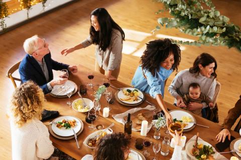 Family gathered around the table for a holiday meal
